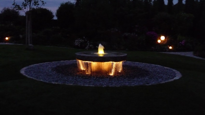 Mhlstein als Springbrunnen